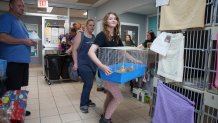 The Bruzdzinski family adopt chicks at First State Animal Center and SPCA on Friday, May 16, 2025, in Camden, Del. (AP Photo/Mingson Lau)